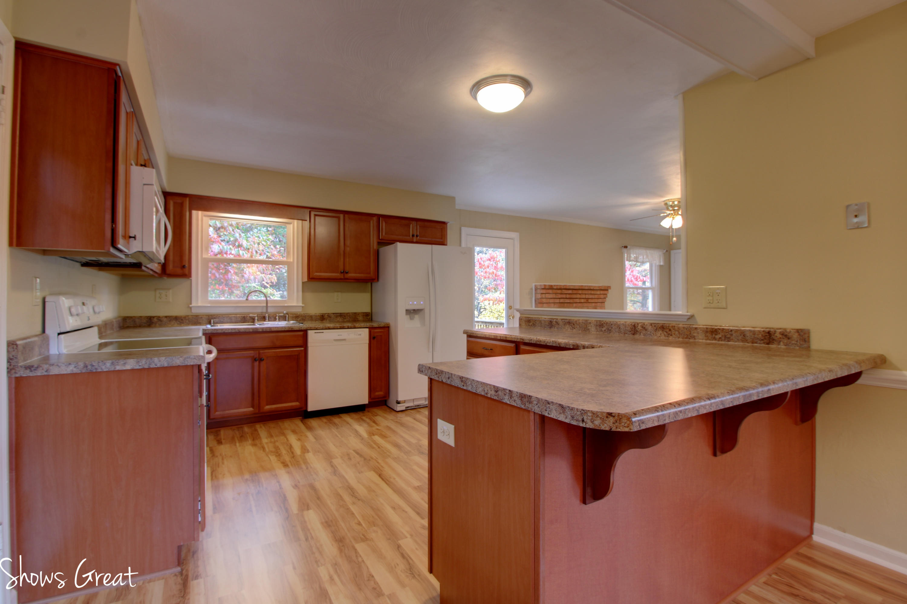 36 Spruce Lane Blue Ridge, VA 24064 - Photo 12 of 35 a kitchen with stainless steel appliances granite countertop a sink a stove and a refrigerator