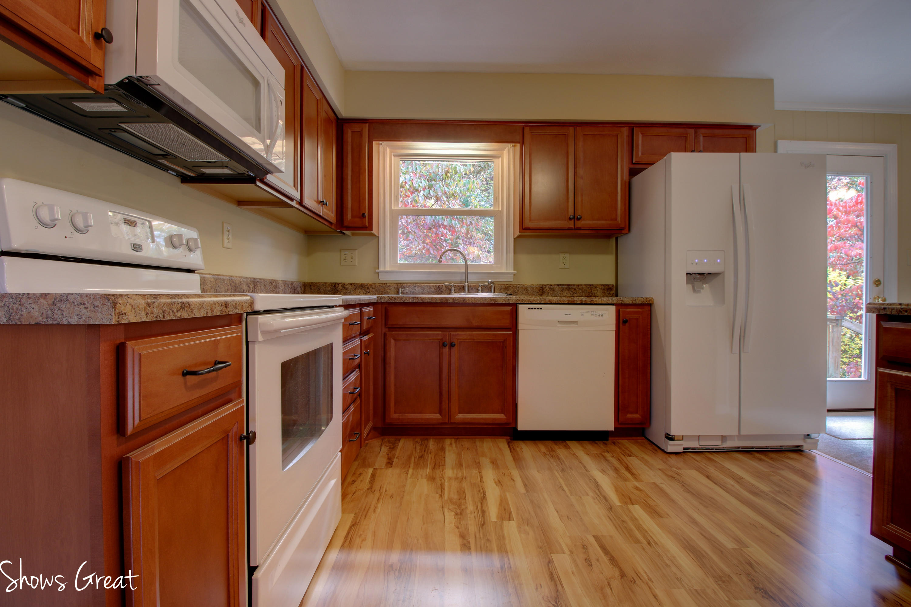 36 Spruce Lane Blue Ridge, VA 24064 - Photo 13 of 35 a kitchen with stainless steel appliances granite countertop wooden floors a stove and a refrigerator