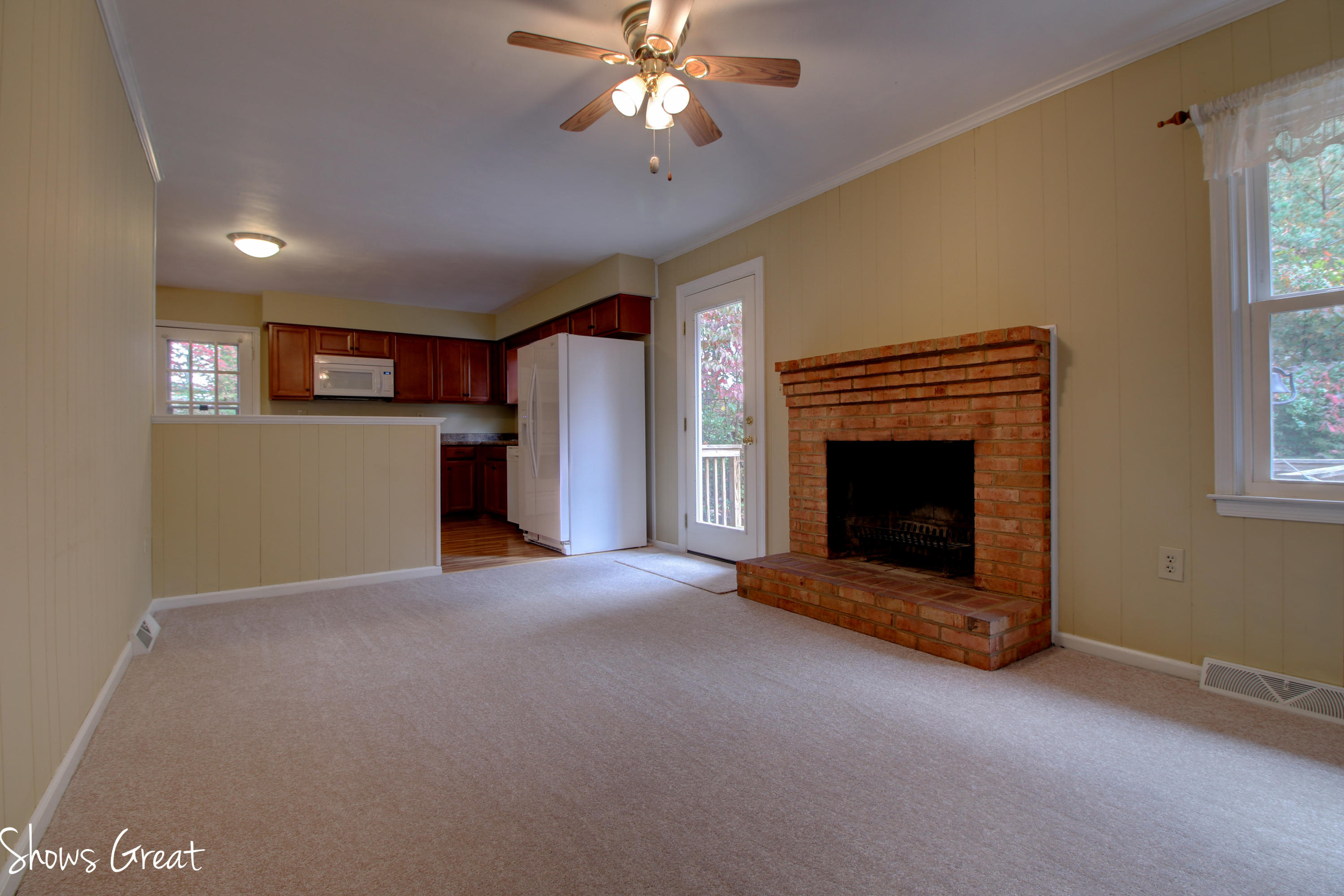 36 Spruce Lane Blue Ridge, VA 24064 - Photo 18 of 35 a view of empty room with a fireplace and windows