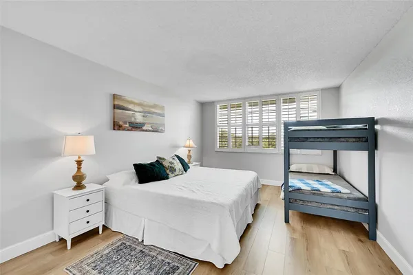 a bedroom with bed and a window