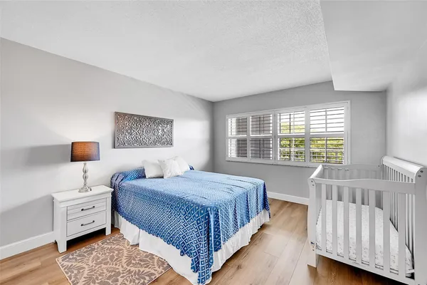 a bathroom with a sink mirror vanity and toilet