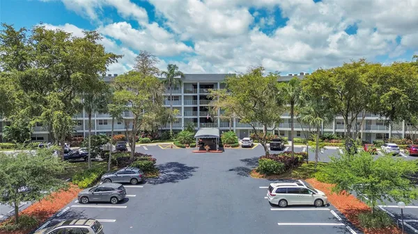 a view of a chairs and table in backyard
