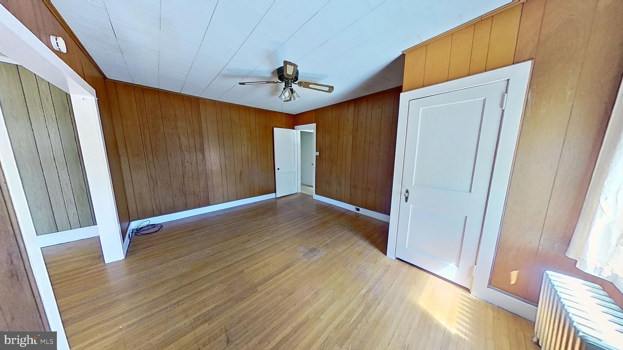 1301 North Duke Street York, PA 17404 - Photo 3 of 8 wooden floor in an empty room