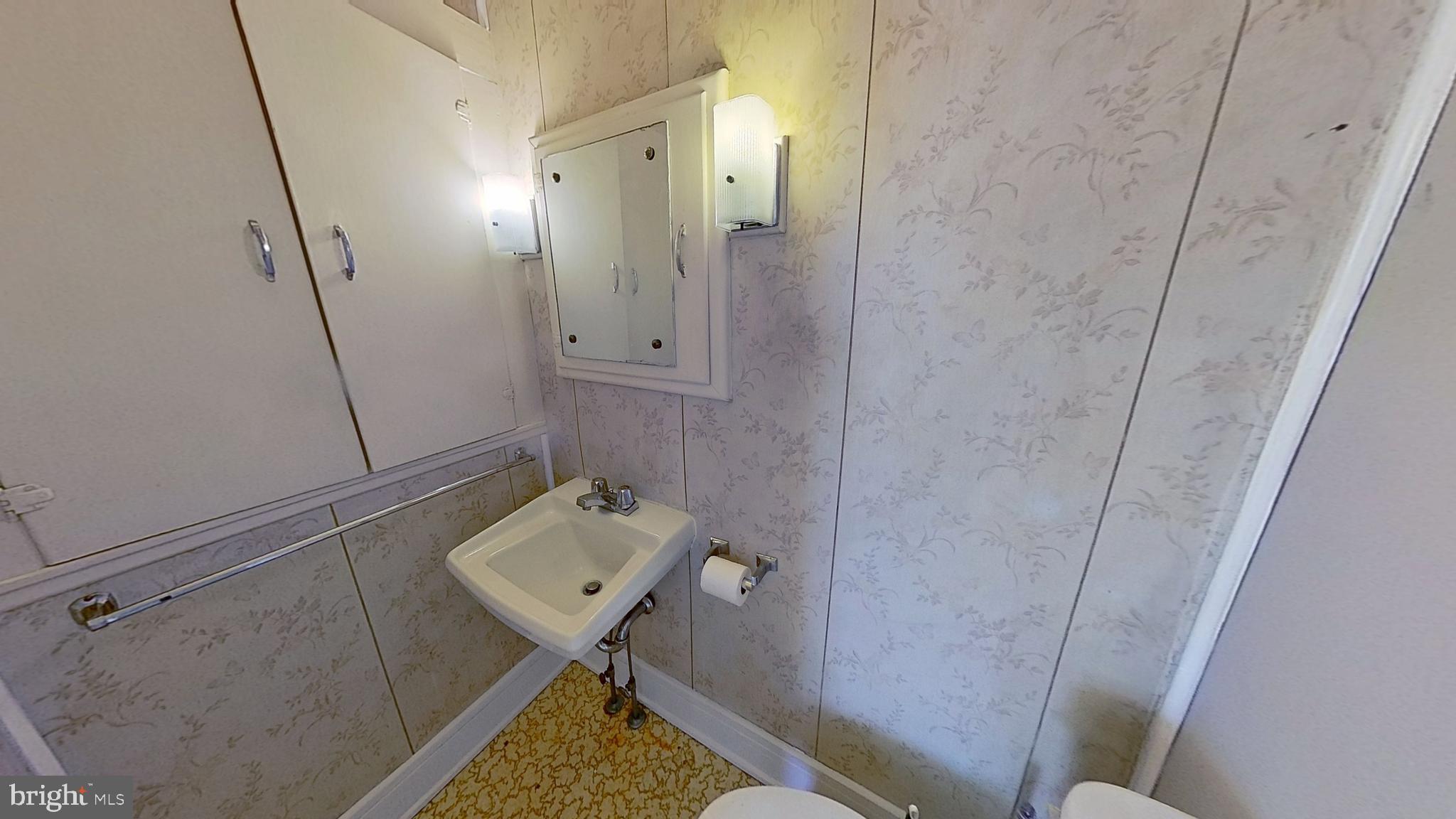 1301 North Duke Street York, PA 17404 - Photo 5 of 8 a bathroom with a sink toilet and shower