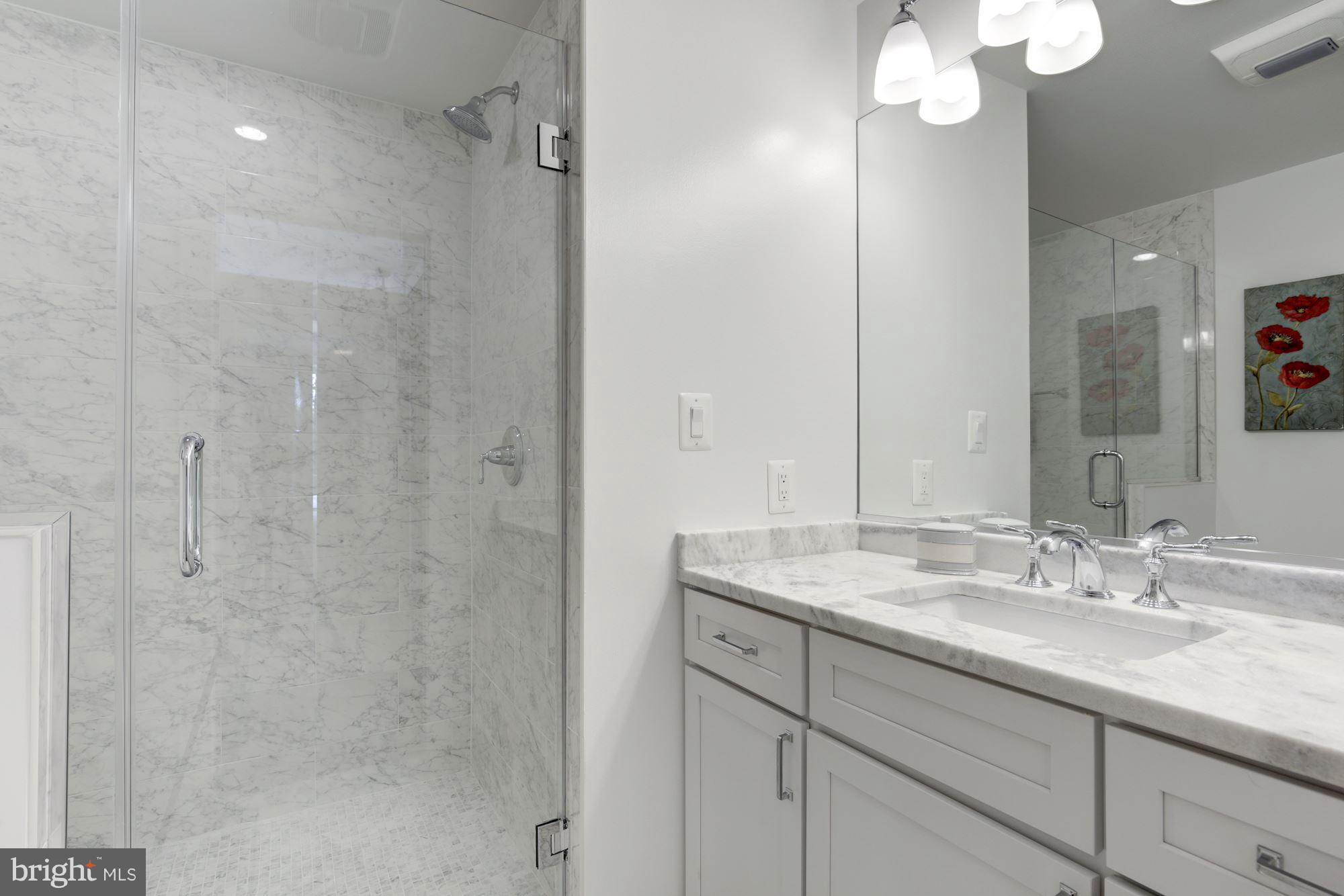 1340 Nicholson Street Northwest, Unit 4 Washington, DC 20011 - Photo 6 of 16 Marble counters, Glass shower, Shaker Cabinetry