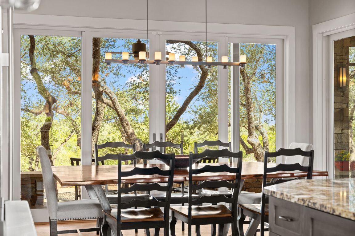 11400 Crumley Ranch Road Austin, TX 78738 - Photo 15 of 39 a view of a dining room with furniture window and outside view
