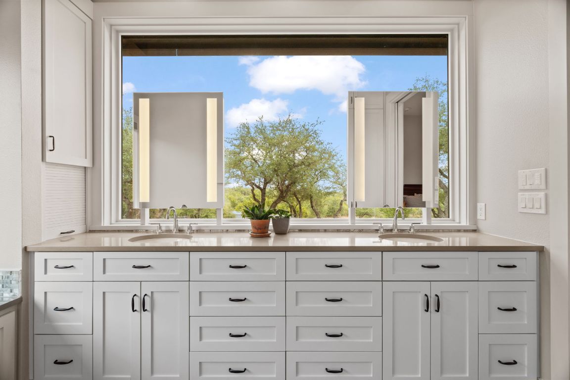 11400 Crumley Ranch Road Austin, TX 78738 - Photo 19 of 39 a bathroom with a sink and a mirror