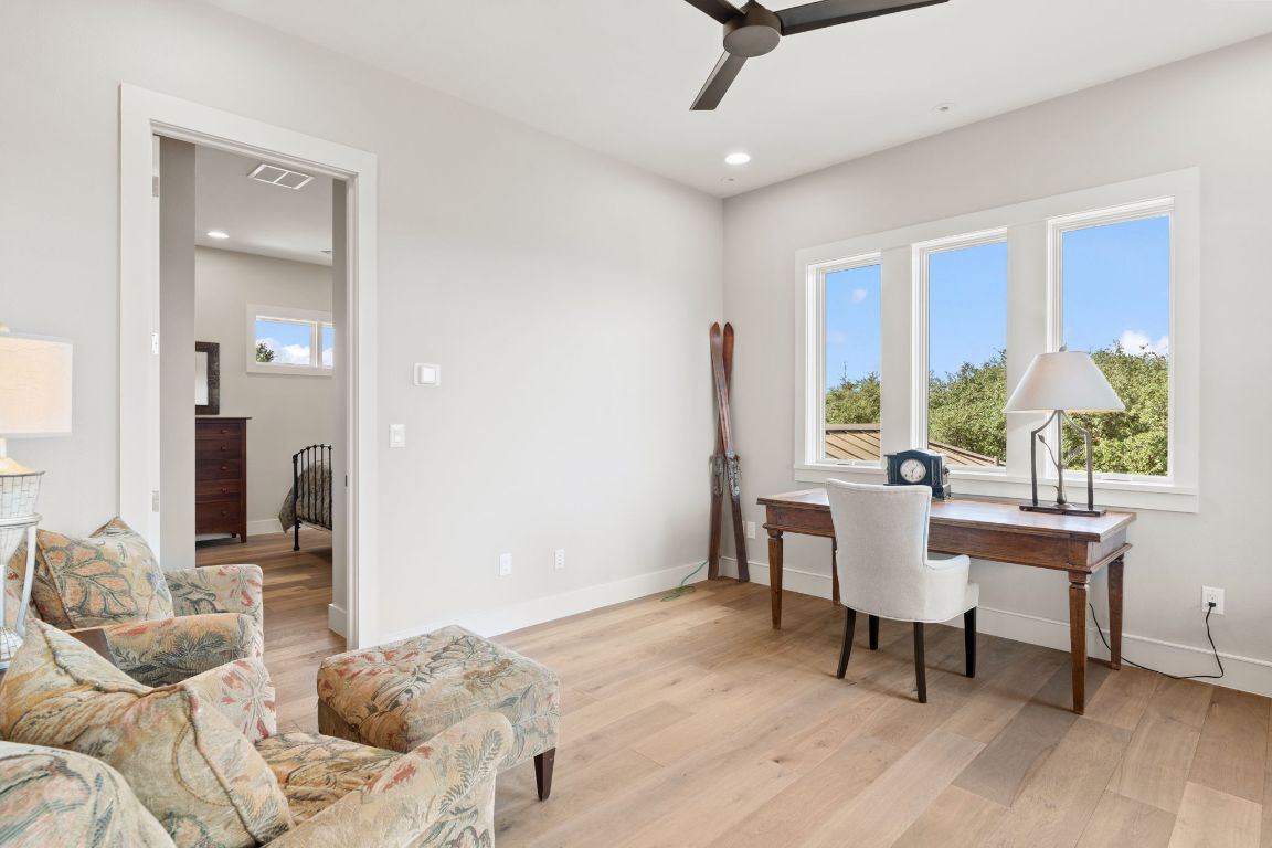 11400 Crumley Ranch Road Austin, TX 78738 - Photo 24 of 39 a bedroom with a bed and a window