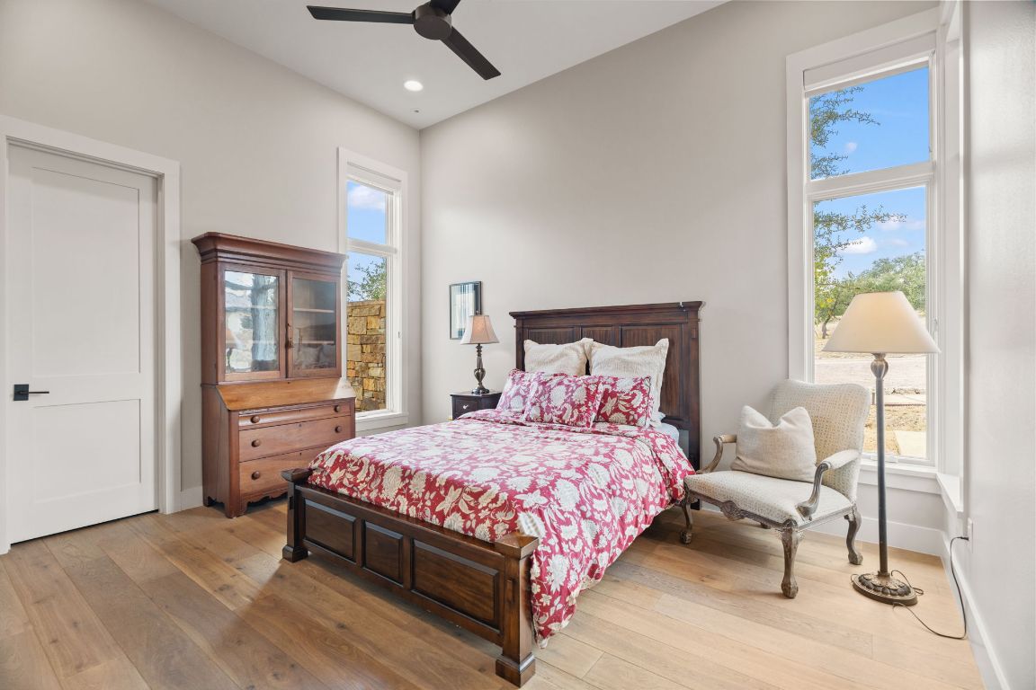 11400 Crumley Ranch Road Austin, TX 78738 - Photo 30 of 39 a bedroom with a bed and window