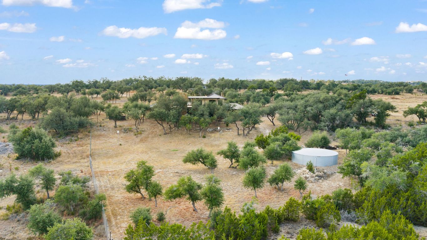 11400 Crumley Ranch Road Austin, TX 78738 - Photo 34 of 39 a view of a lake with a house in the background