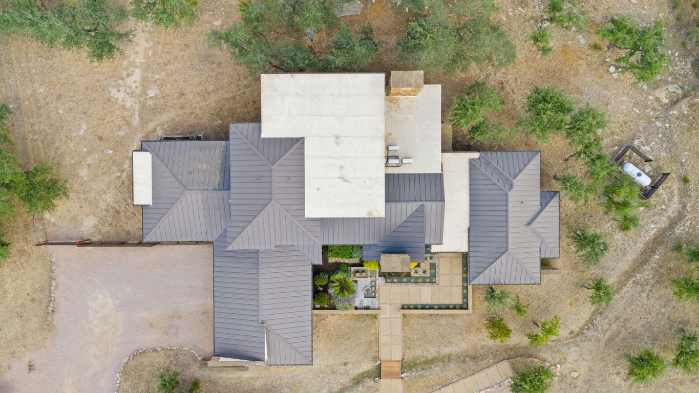 11400 Crumley Ranch Road Austin, TX 78738 - Photo 35 of 39 aerial view of a house with a yard and large trees