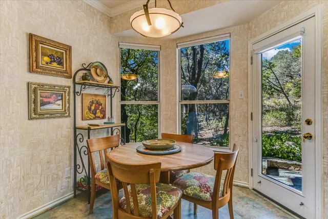 a view of a dining room with furniture window and outside view