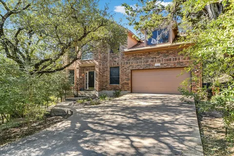 a front view of a house with yard