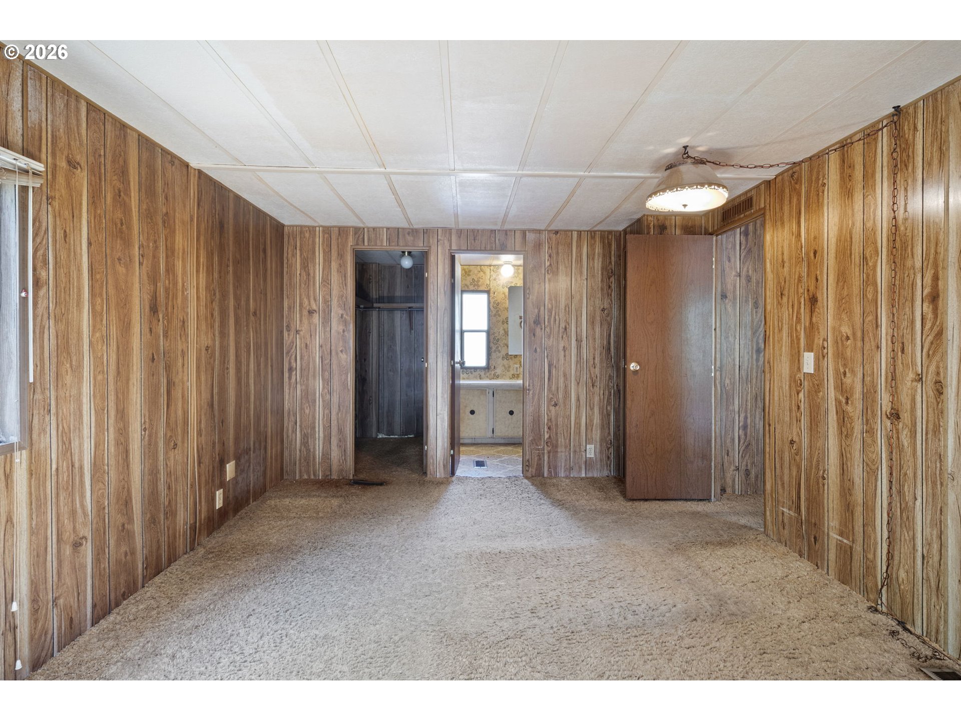4950 Foothill Boulevard Grants Pass, OR 97526 - Photo 17 of 43 a view of a hallway with wooden shelves