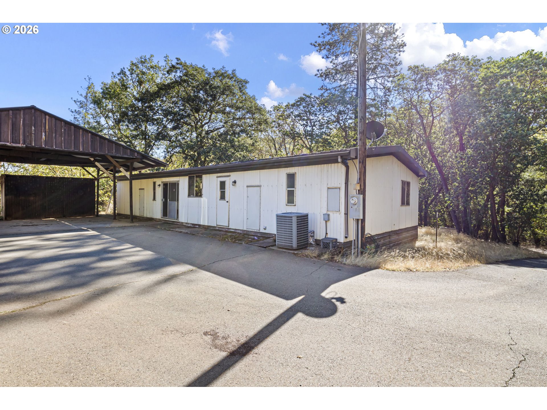 4950 Foothill Boulevard Grants Pass, OR 97526 - Photo 20 of 43 a view of a house with a yard