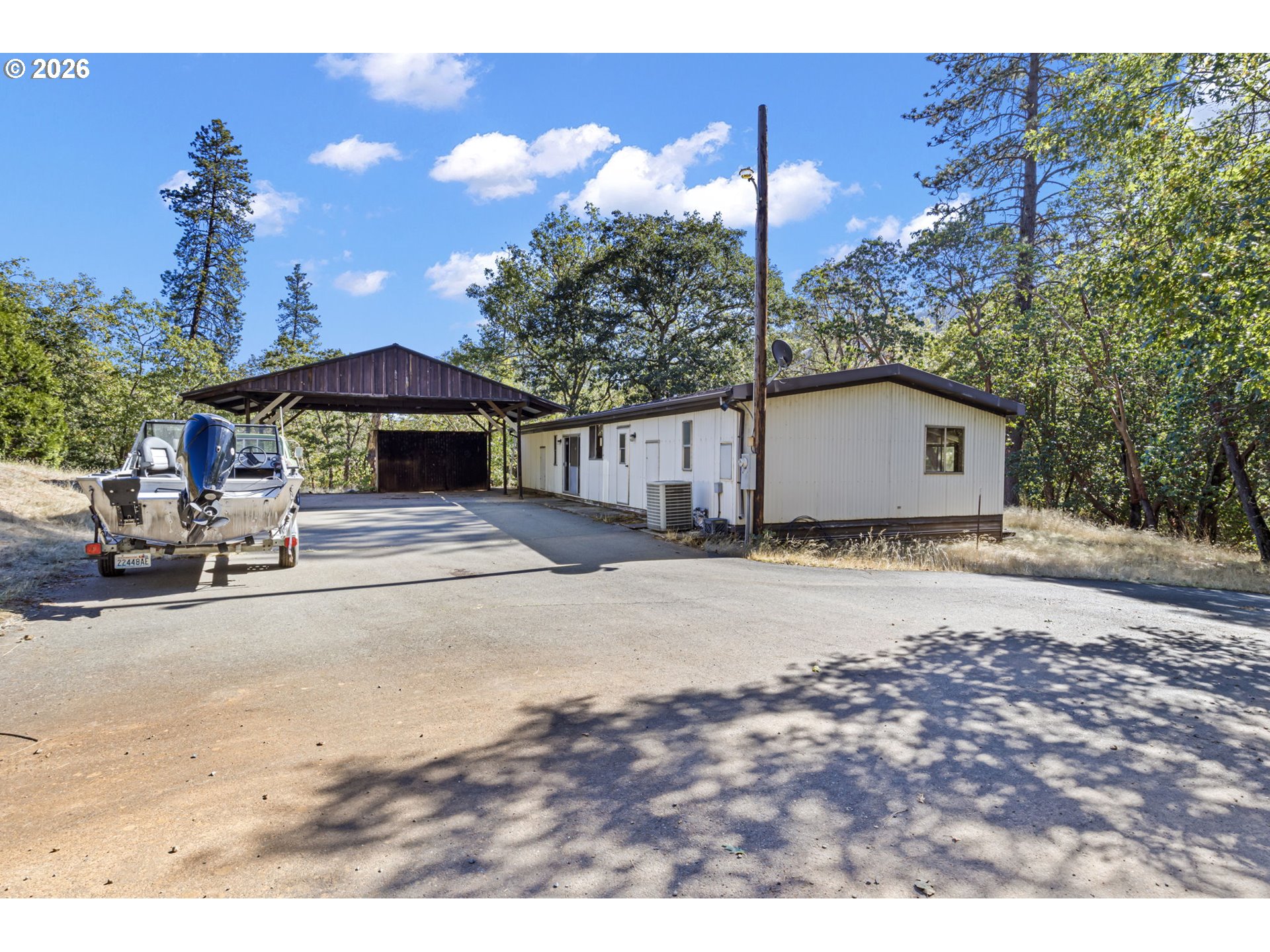 4950 Foothill Boulevard Grants Pass, OR 97526 - Photo 2 of 43 a house view with a outdoor space