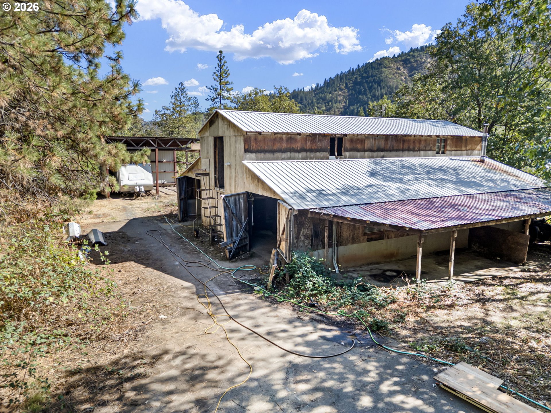 4950 Foothill Boulevard Grants Pass, OR 97526 - Photo 36 of 43 a view of house with backyard and seating space