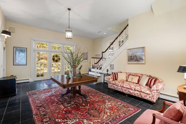 a living room with furniture or couch and a wooden floor