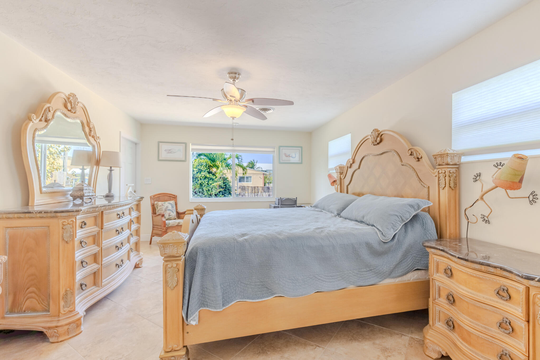 234 49th Street Marathon, FL 33050 - Photo 25 of 52 a bedroom with a bed and a chandelier