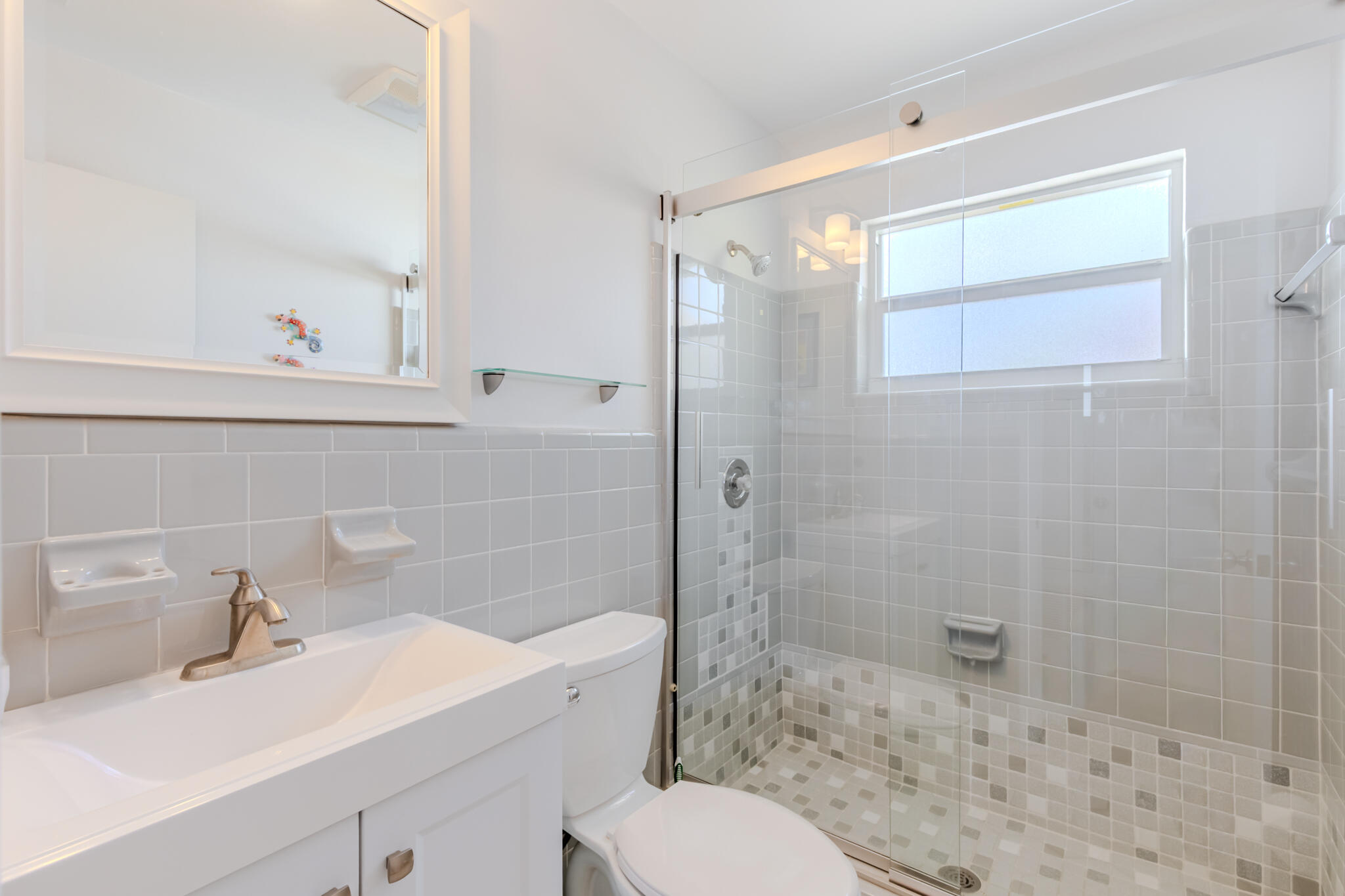 234 49th Street Marathon, FL 33050 - Photo 32 of 52 a bathroom with a sink toilet a mirror and shower