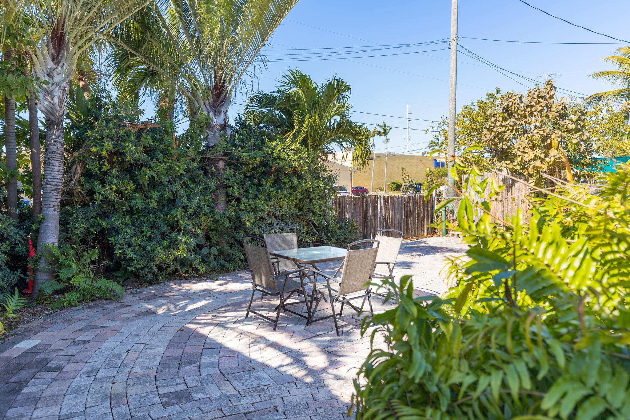 234 49th Street Marathon, FL 33050 - Photo 36 of 52 a view of a patio with table and chairs and potted plants