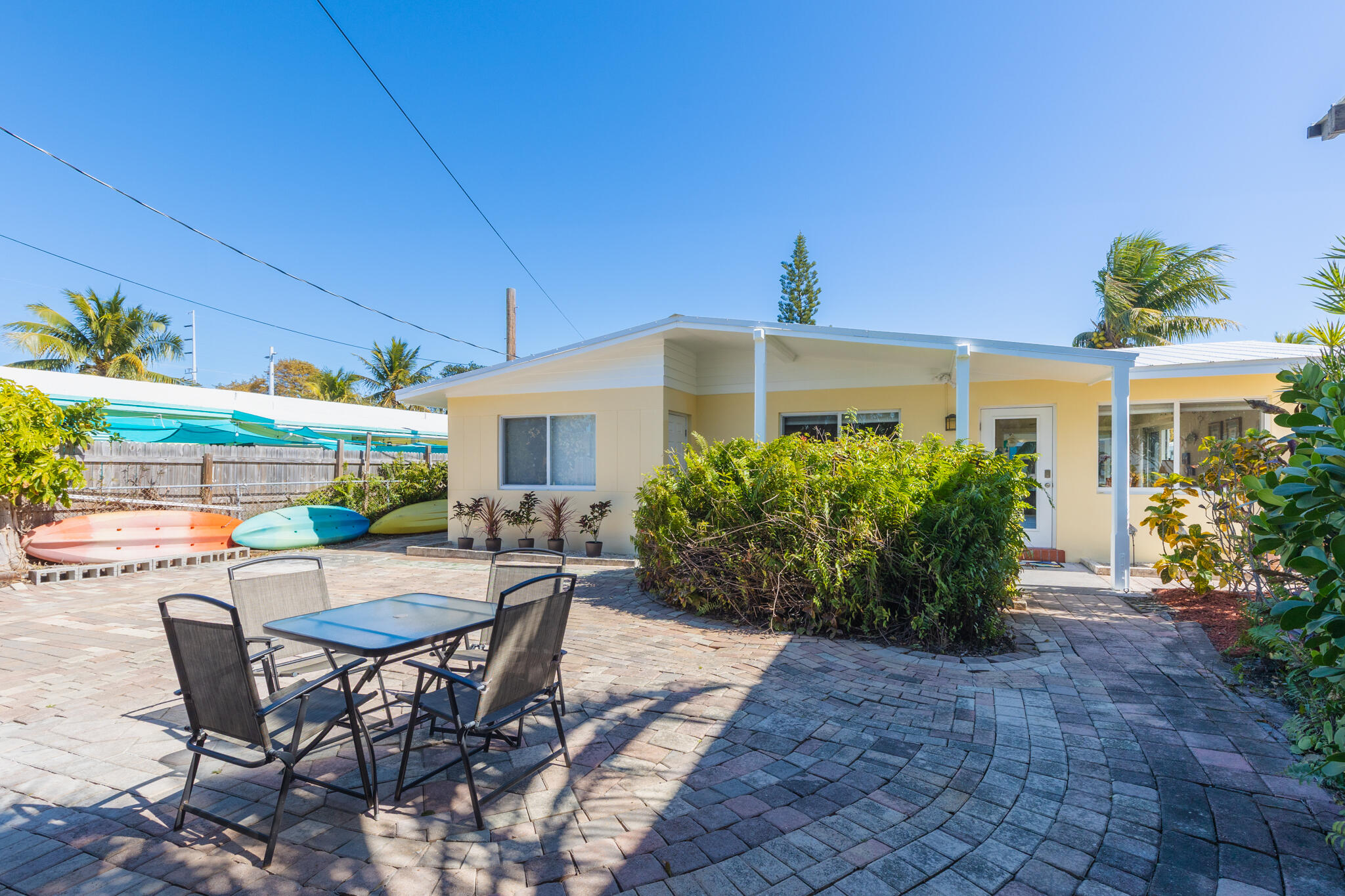 234 49th Street Marathon, FL 33050 - Photo 38 of 52 a view of a patio with table and chairs and potted plants