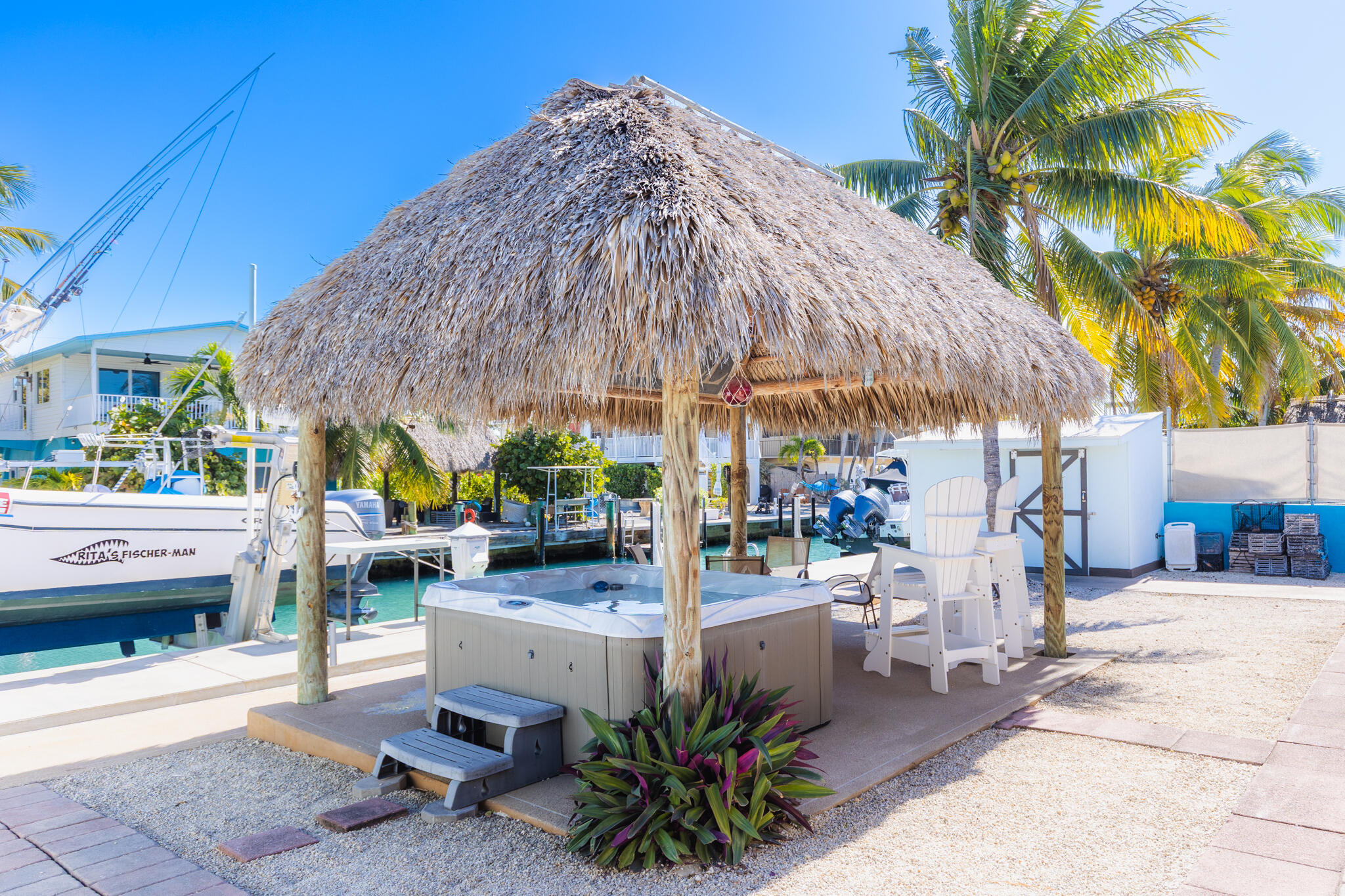 234 49th Street Marathon, FL 33050 - Photo 39 of 52 a view of a patio with table and chairs under an umbrella