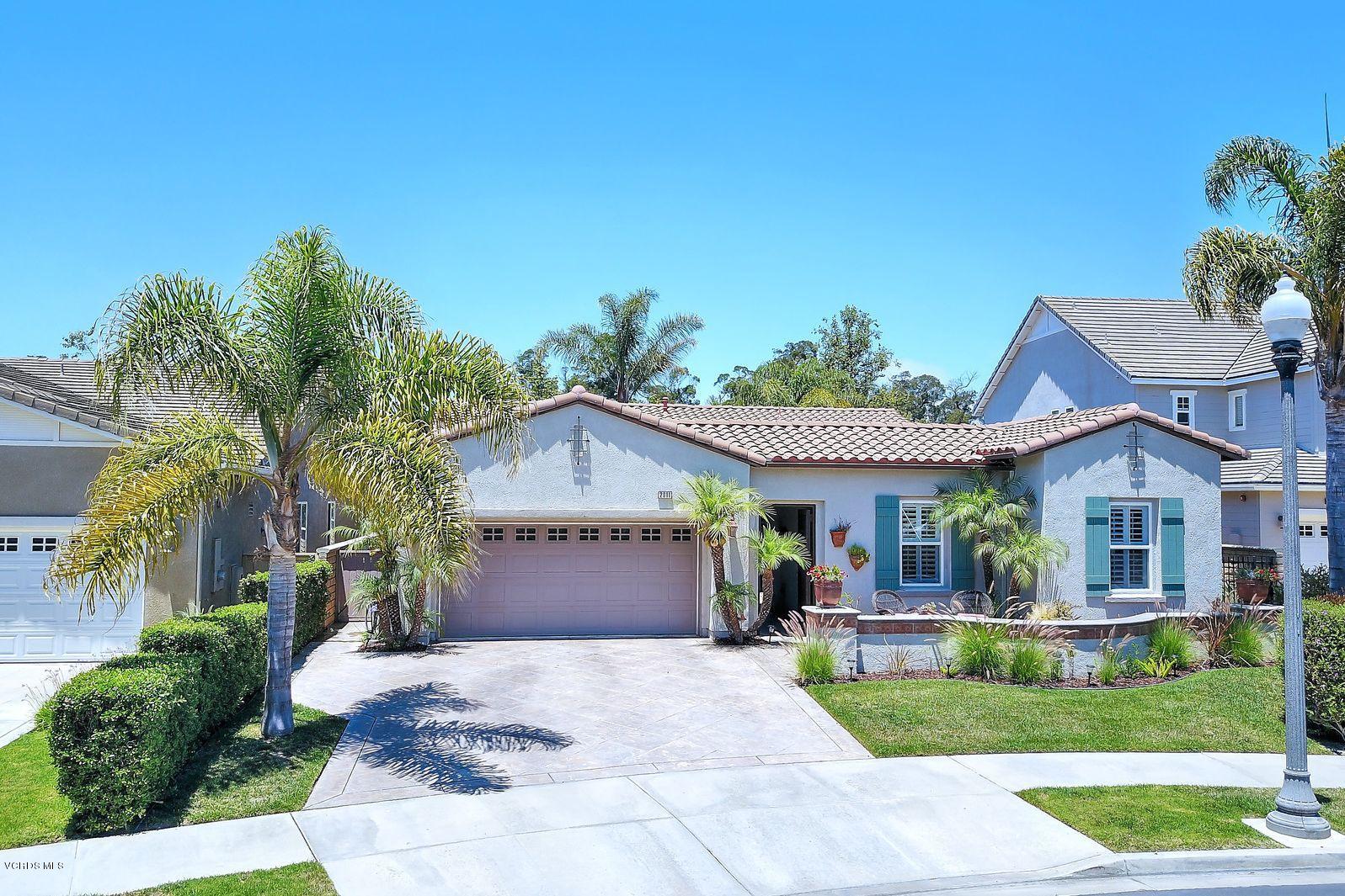 2011 Turnberry Drive Oxnard, CA 93036 - Photo 1 of 56 a front view of a house with a yard and garage