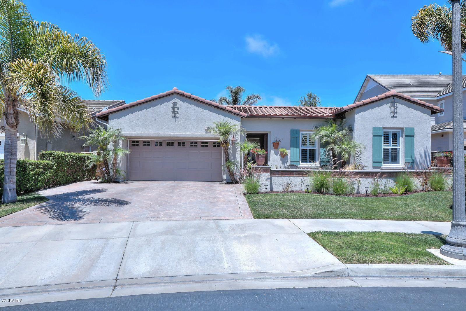 2011 Turnberry Drive Oxnard, CA 93036 - Photo 2 of 56 a front view of a house with a yard and garage
