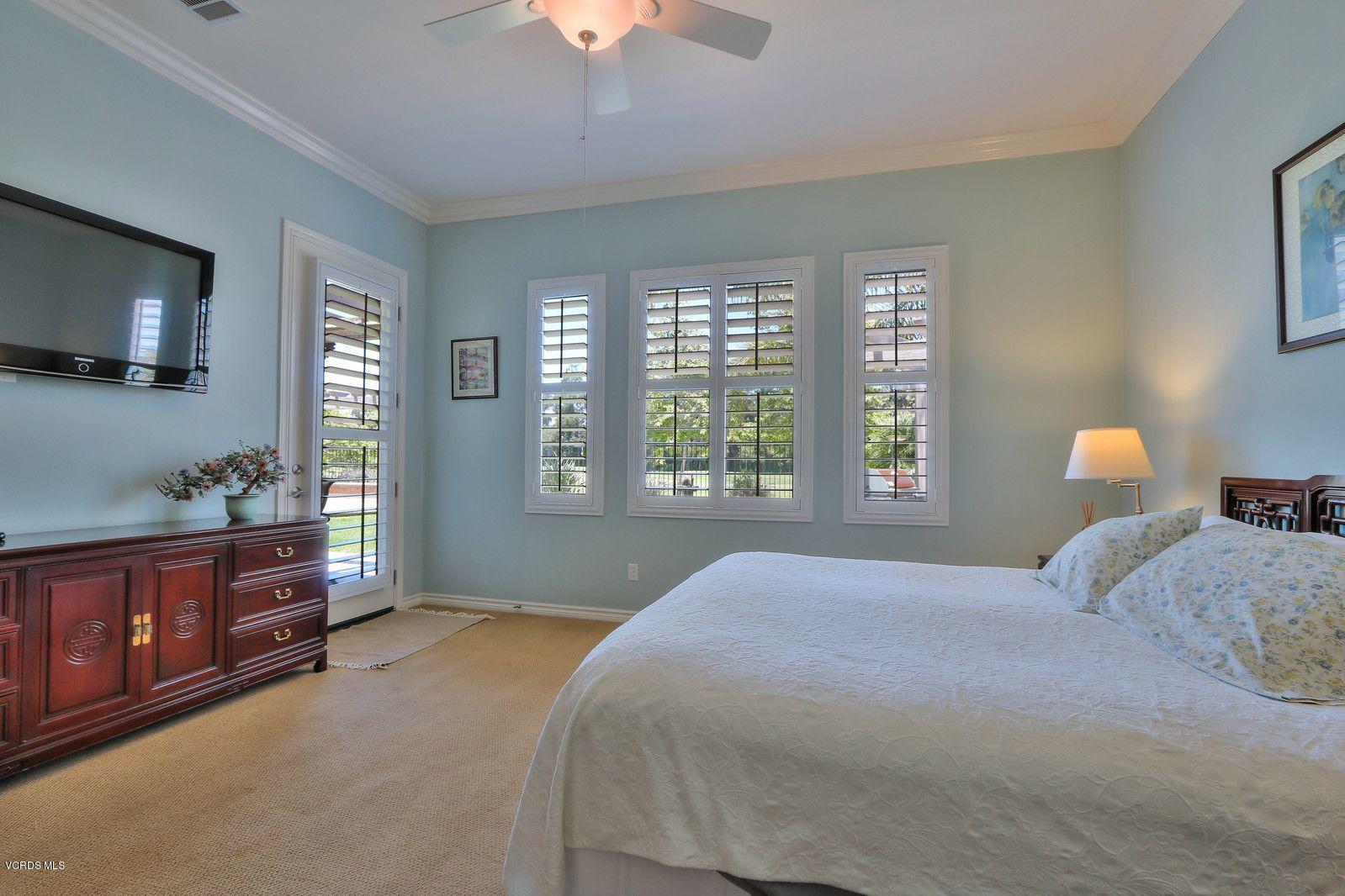 2011 Turnberry Drive Oxnard, CA 93036 - Photo 15 of 56 a bedroom with a large bed and a tv on a dresser