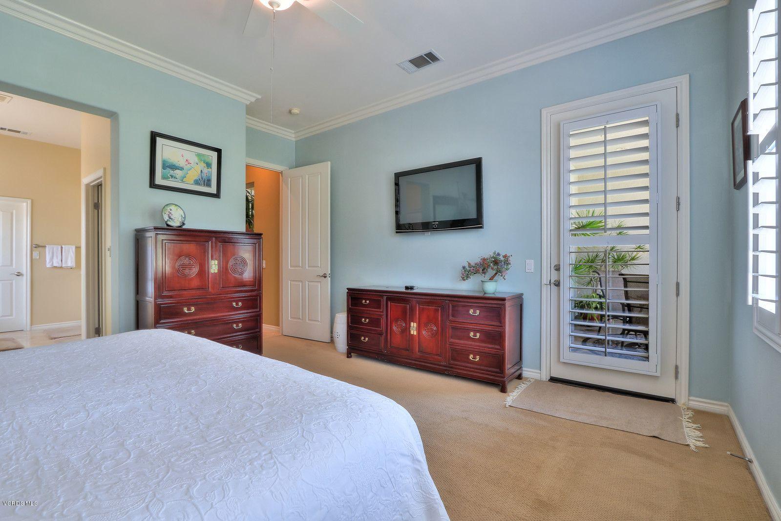 2011 Turnberry Drive Oxnard, CA 93036 - Photo 17 of 56 a bedroom with a bed and a flat screen tv