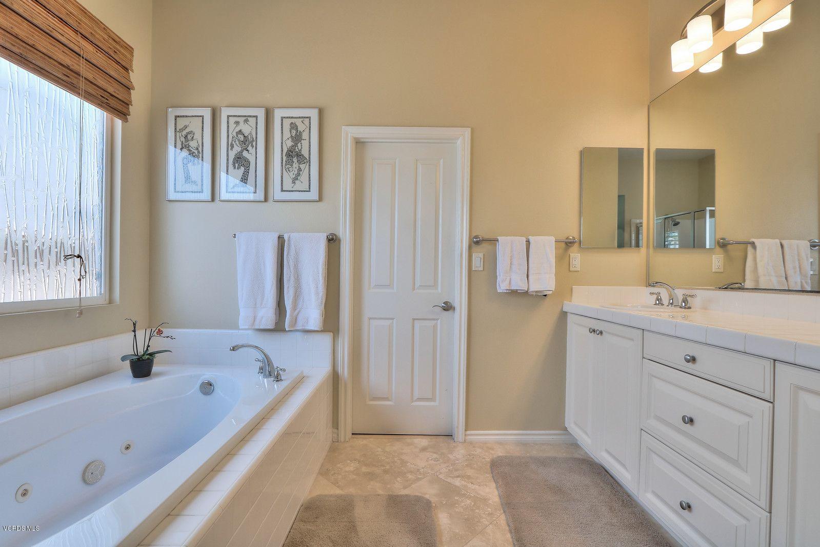 2011 Turnberry Drive Oxnard, CA 93036 - Photo 21 of 56 a bathroom with a bathtub and a sink