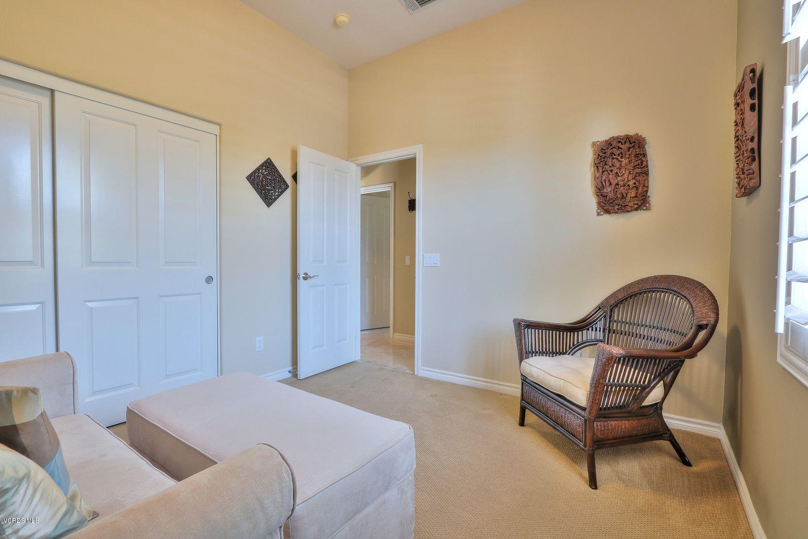 2011 Turnberry Drive Oxnard, CA 93036 - Photo 31 of 56 a bedroom with a bed and a chair