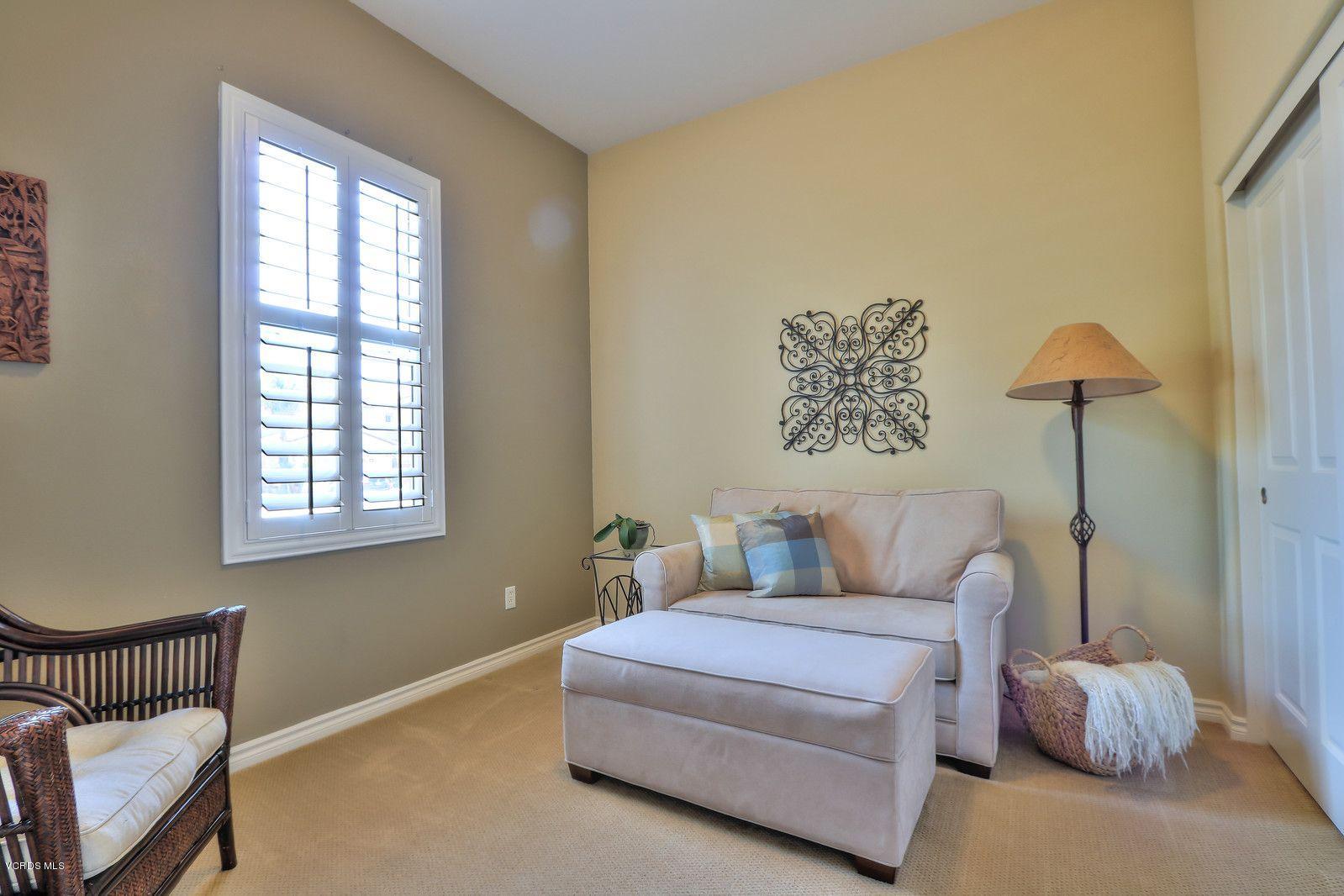 2011 Turnberry Drive Oxnard, CA 93036 - Photo 32 of 56 a bedroom with a bed and a lamp