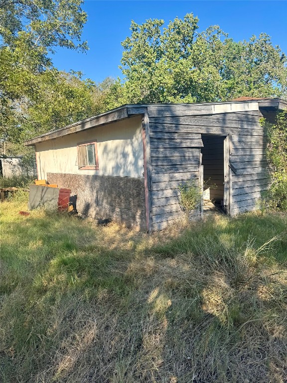 117 Charles Street Cuero, TX 77954 - Photo 2 of 13 a backyard of a house with lots of green space