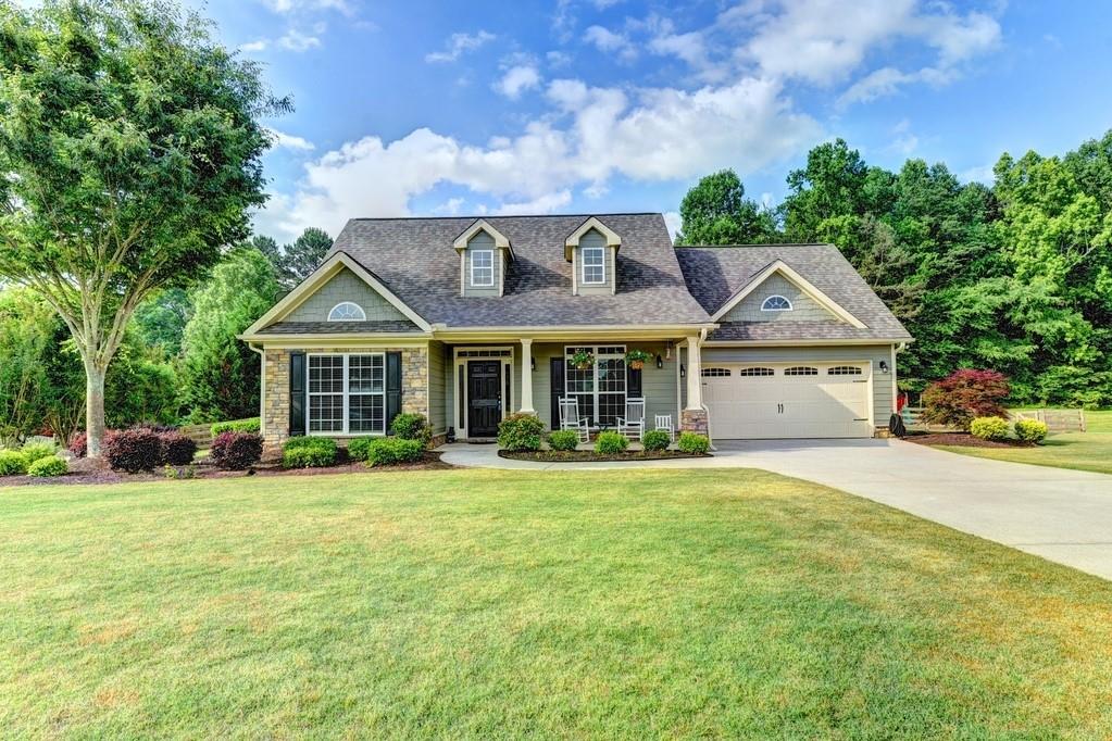 203 Raven Ridge Jefferson, GA 30549 - Photo 1 of 1 a front view of a house with a yard