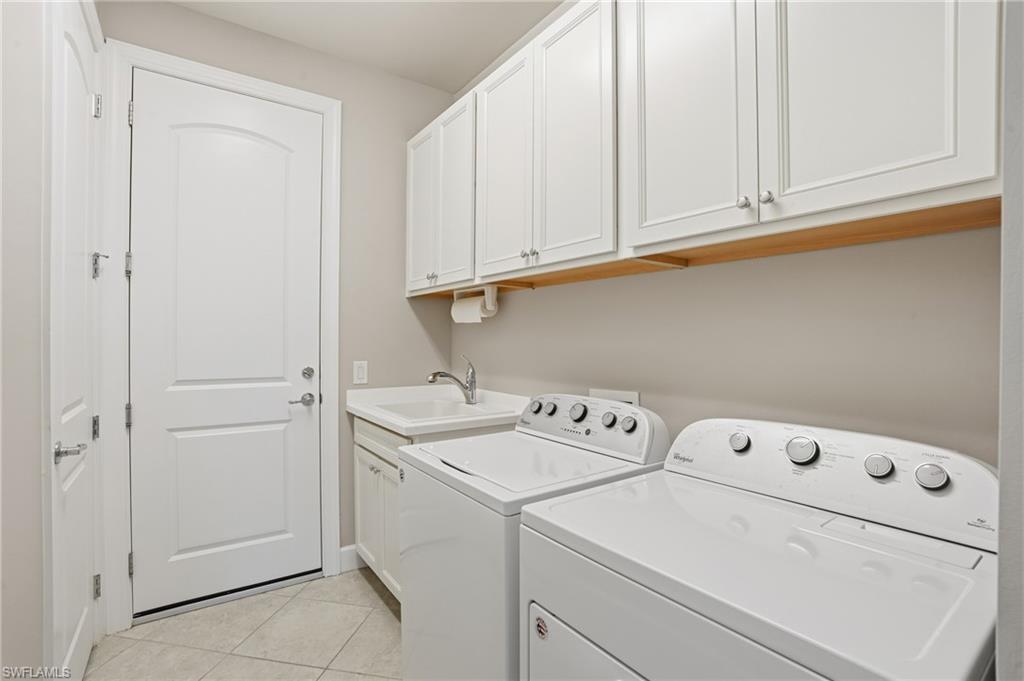20143 Torch Key Way Estero, FL 33928 - Photo 17 of 26 a utility room with dryer and washer