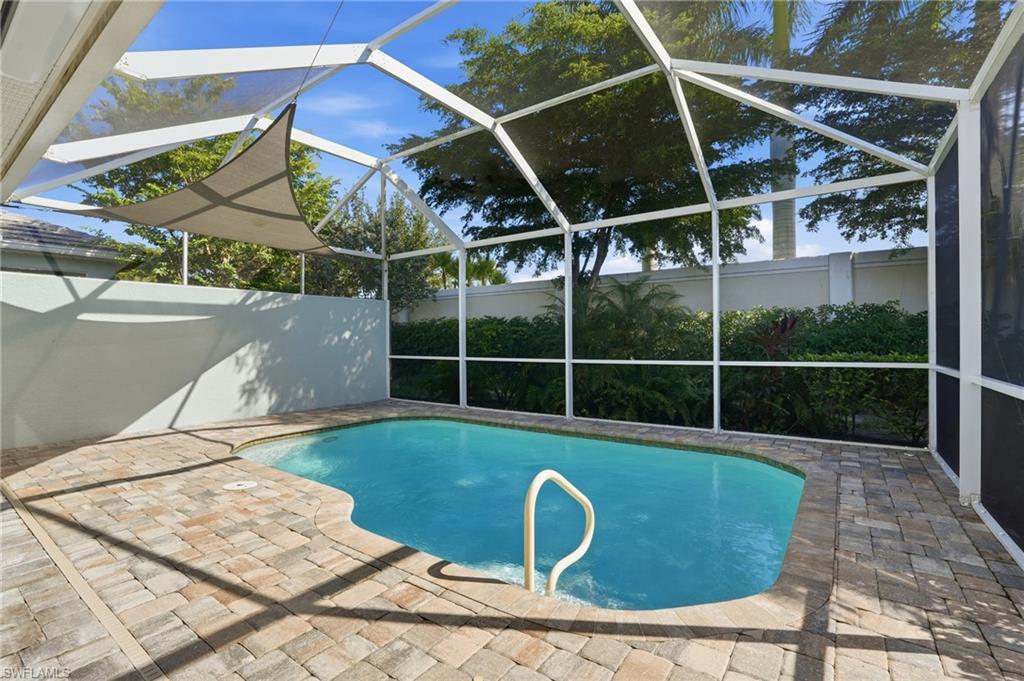 20143 Torch Key Way Estero, FL 33928 - Photo 2 of 26 a view of a backyard with table and chairs