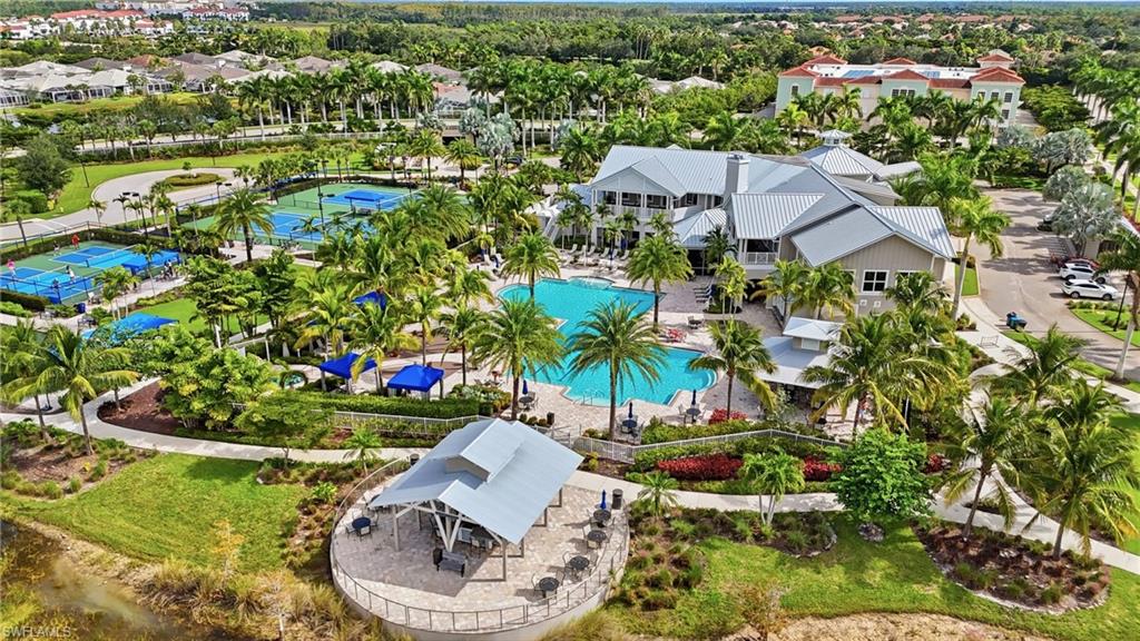 20143 Torch Key Way Estero, FL 33928 - Photo 24 of 26 a view of a white house with a yard and plants