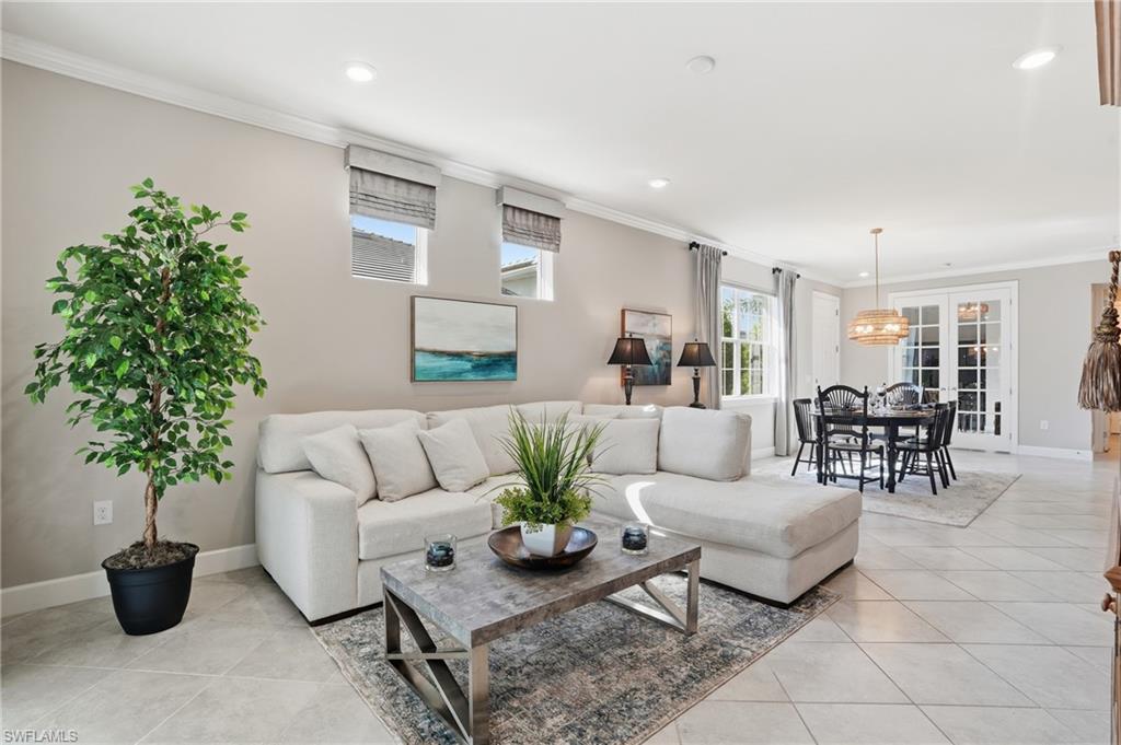 20143 Torch Key Way Estero, FL 33928 - Photo 3 of 26 a living room with furniture and a potted plant