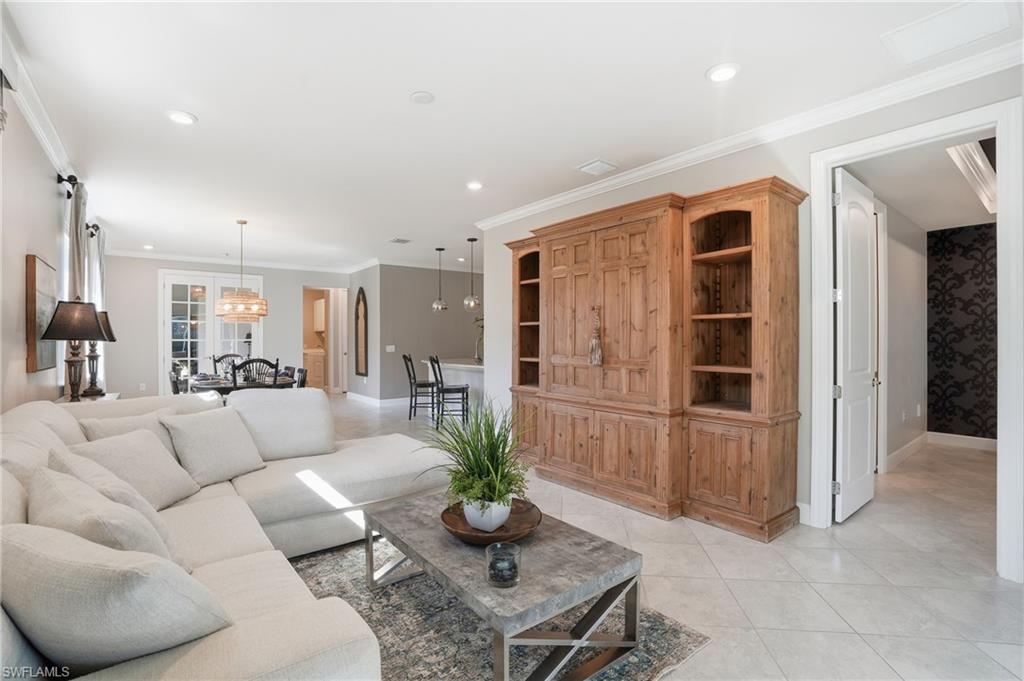 20143 Torch Key Way Estero, FL 33928 - Photo 4 of 26 a living room with furniture potted plant and kitchen view