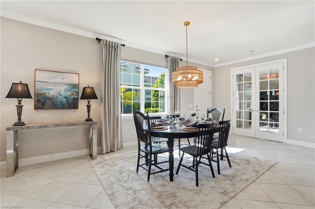 20143 Torch Key Way Estero, FL 33928 - Photo 8 of 26 a view of a dining room with furniture window and outside view