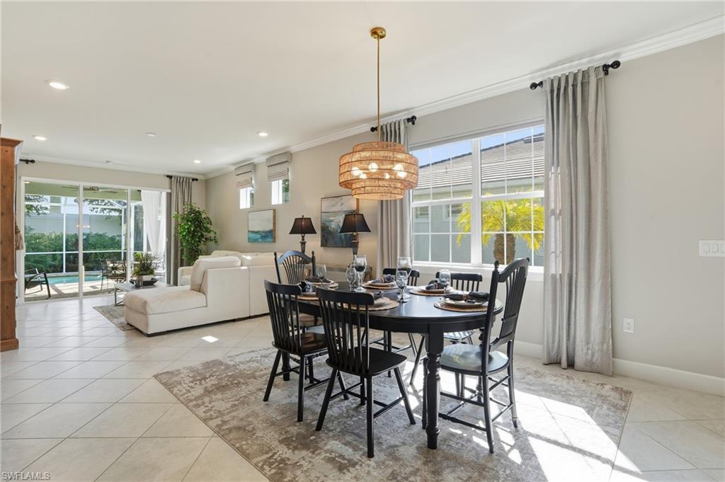 20143 Torch Key Way Estero, FL 33928 - Photo 9 of 26 a view of a dining room with furniture window and outside view
