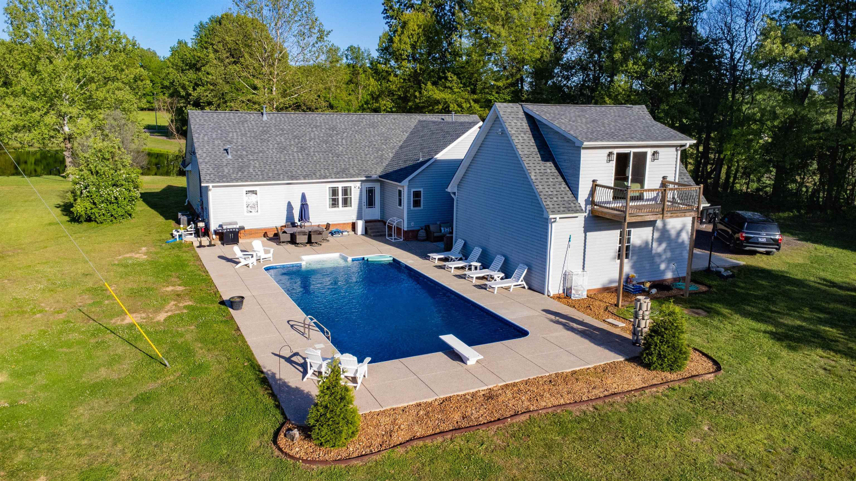 495 Junius Lee Road Ripley, TN 38063 - Photo 11 of 38 a aerial view of a house with swimming pool and sitting area