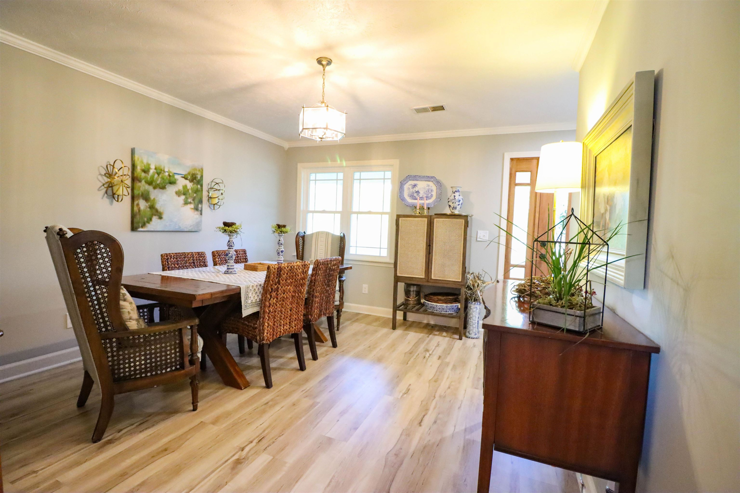 495 Junius Lee Road Ripley, TN 38063 - Photo 19 of 38 a view of a dining room with furniture window and wooden floor