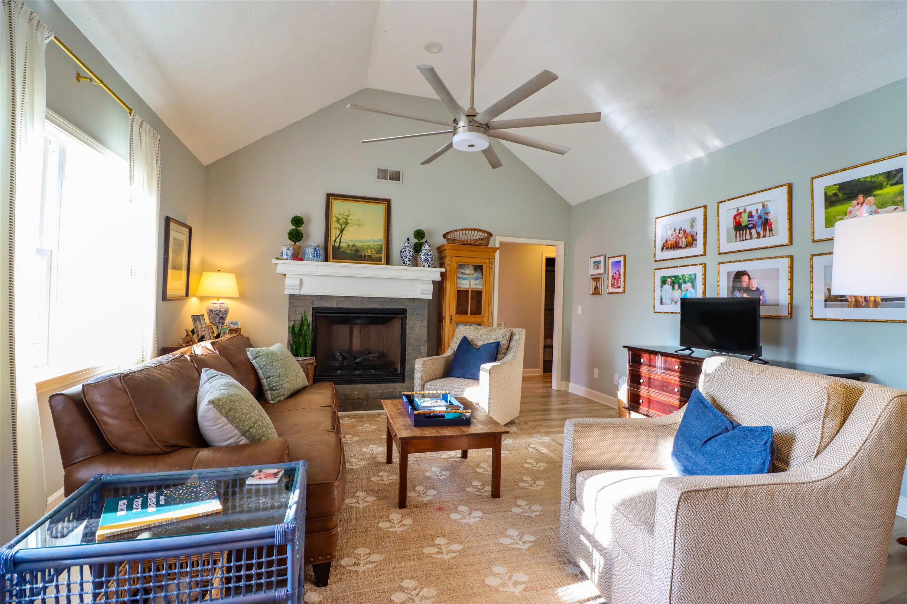 495 Junius Lee Road Ripley, TN 38063 - Photo 22 of 38 a living room with furniture a flat screen tv and a fireplace