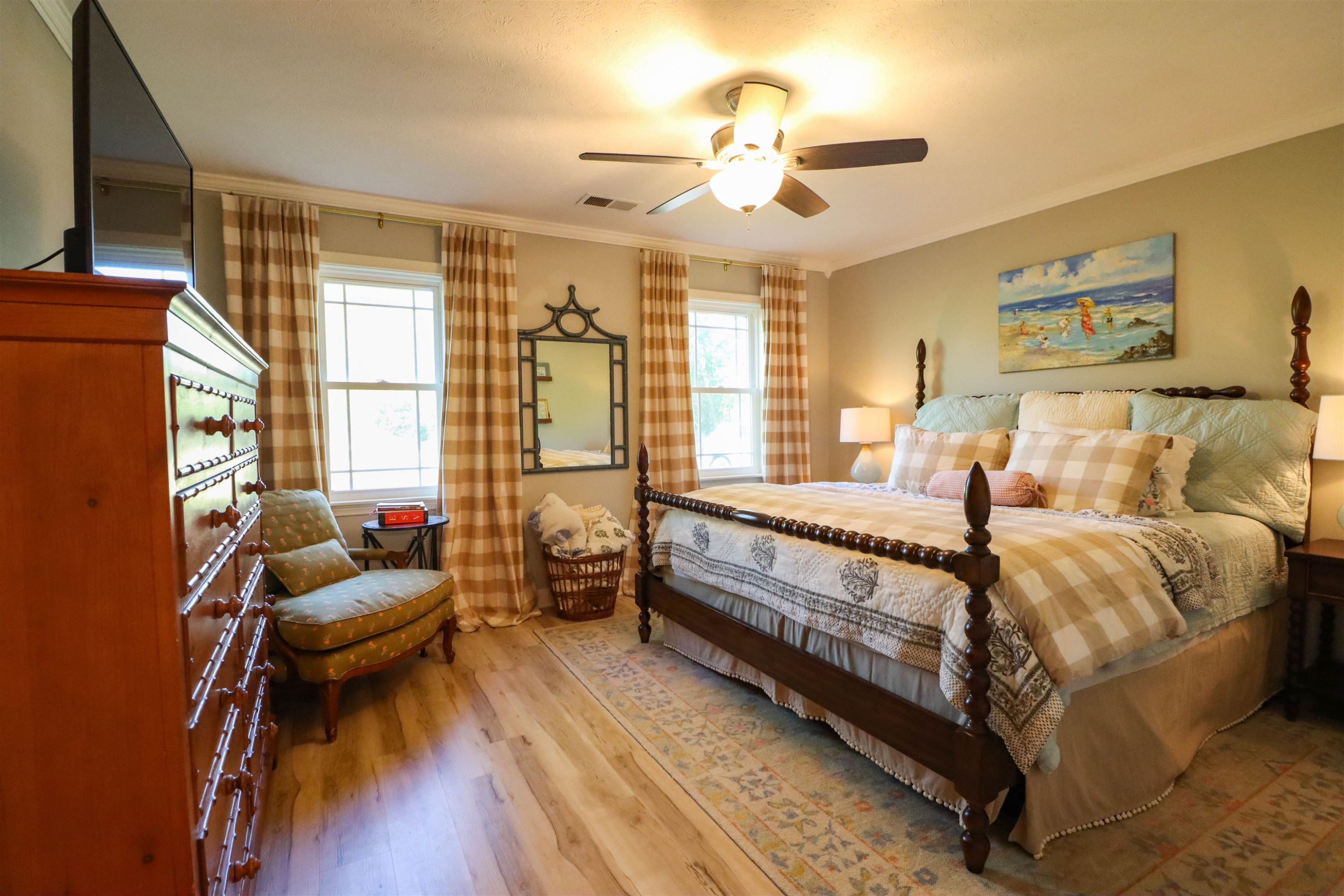 495 Junius Lee Road Ripley, TN 38063 - Photo 24 of 38 a bed room with a bed and a chandelier
