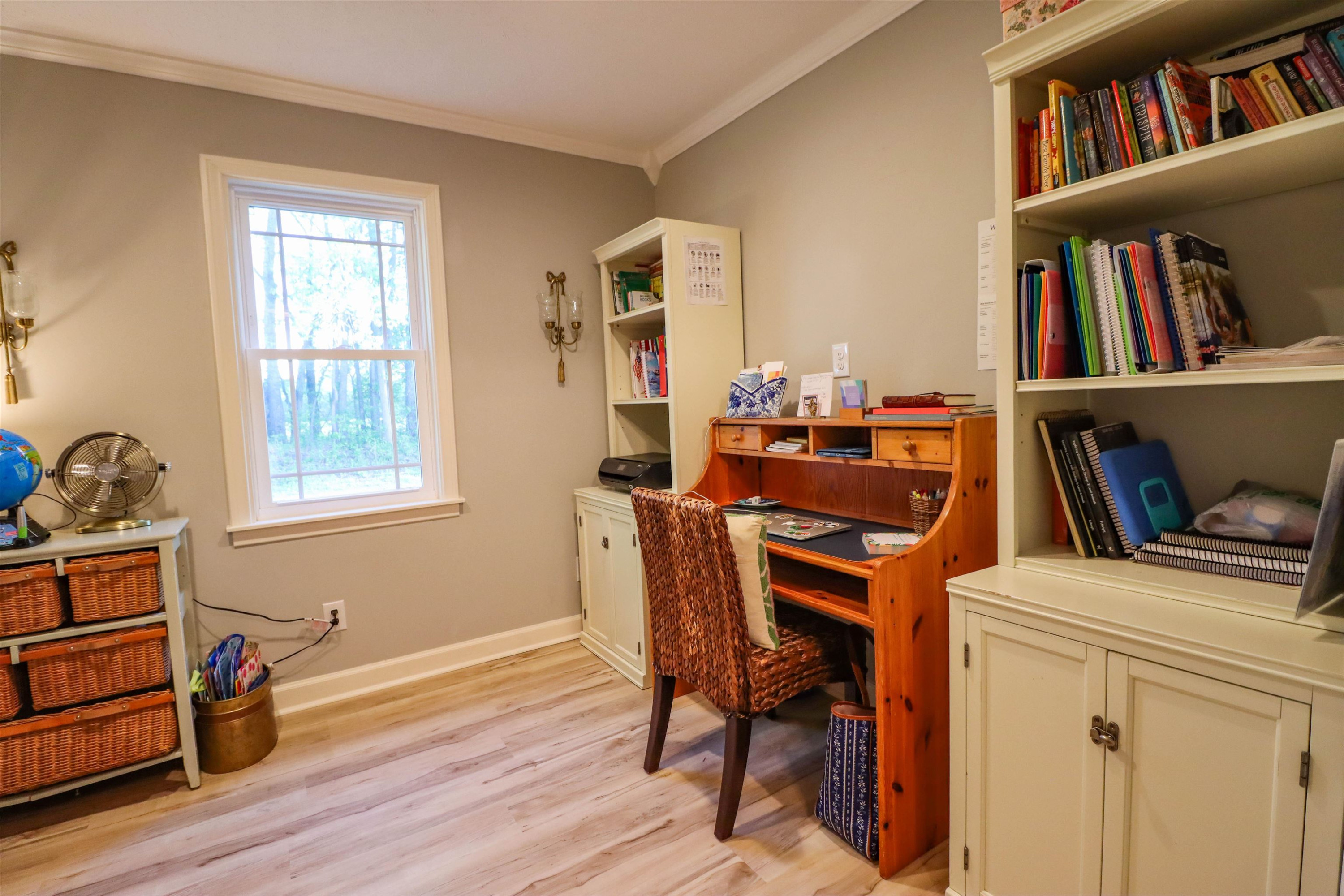 495 Junius Lee Road Ripley, TN 38063 - Photo 25 of 38 a view of a workspace with furniture and a book shelf