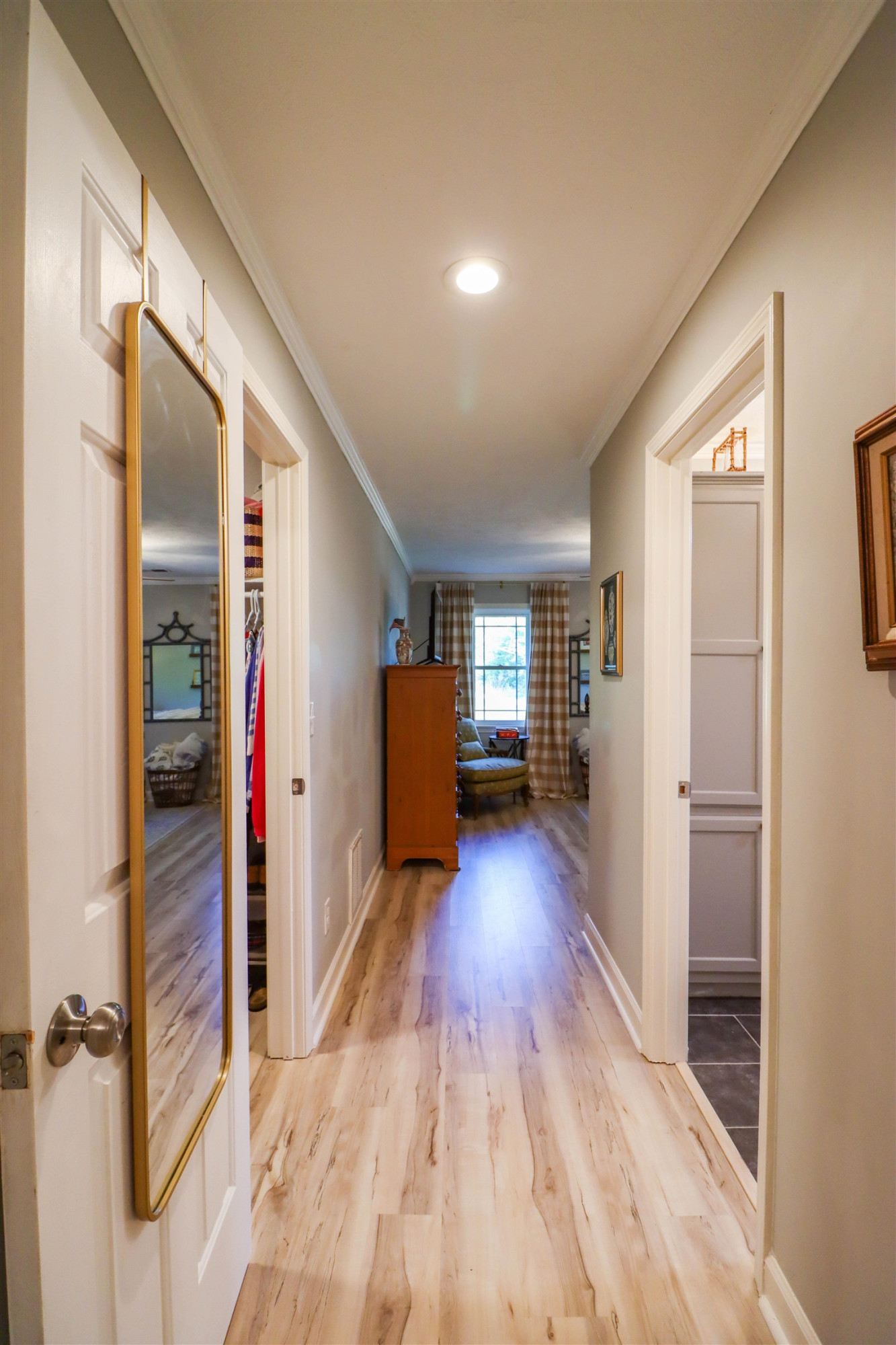 495 Junius Lee Road Ripley, TN 38063 - Photo 27 of 38 a view of a hallway with wooden floor and livingroom