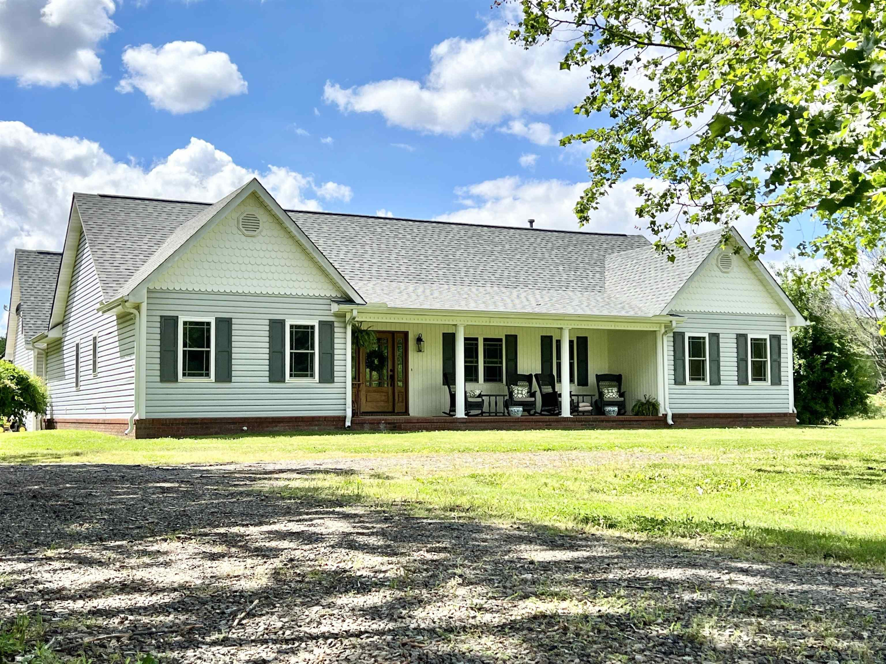 495 Junius Lee Road Ripley, TN 38063 - Photo 3 of 38 a view of a house with swimming pool and a yard